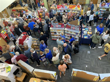 All generations love reading at the book fair.